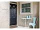 Charming front door entry with a small table and chair at 1473 Farrindon Cir, Lake Mary, FL 32746