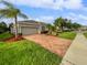 One-story house with attractive landscaping and a paved driveway at 14401 Black Lake Preserve St, Winter Garden, FL 34787