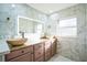 Elegant bathroom with double sinks, marble tile, and modern fixtures at 400 W Trotters Dr, Maitland, FL 32751