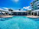 Resort-style pool with a clubhouse and lounge chairs at 5 Riverwalk Dr # 407, New Smyrna Beach, FL 32169