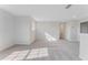 Open loft area with grey carpet and natural light at 33279 Country House Dr, Sorrento, FL 32776