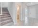 Staircase with grey carpet leading to the second floor at 33279 Country House Dr, Sorrento, FL 32776