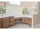 Bathroom with double sinks, a large mirror, and striped wallpaper at 6659 Crenshaw Dr, Orlando, FL 32835