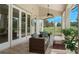 Relaxing screened patio with comfortable seating and views of the backyard at 6659 Crenshaw Dr, Orlando, FL 32835