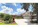 Beautiful two-story home with landscaped yard and large driveway at 6659 Crenshaw Dr, Orlando, FL 32835
