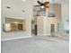 Open living room with high ceilings and a view to kitchen at 6659 Crenshaw Dr, Orlando, FL 32835