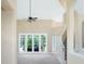 Large living room with double doors leading to the outside at 6659 Crenshaw Dr, Orlando, FL 32835