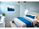 Serene bedroom with a queen-size bed and soothing color palette at 6659 Crenshaw Dr, Orlando, FL 32835