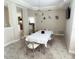 Formal dining room with a large table and access to the kitchen at 6659 Crenshaw Dr, Orlando, FL 32835