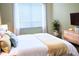 Bright bedroom with a queen-size bed and modern decor at 6659 Crenshaw Dr, Orlando, FL 32835