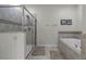 Relaxing bathroom with soaking tub and shower at 1427 Rolling Fairway Dr, Davenport, FL 33896