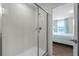 Bathroom with a large walk-in shower and access to bedroom at 1427 Rolling Fairway Dr, Davenport, FL 33896