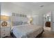 Spacious bedroom with king-size bed and ensuite bathroom at 1427 Rolling Fairway Dr, Davenport, FL 33896