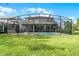 Large backyard with a screened pool and spa at 1427 Rolling Fairway Dr, Davenport, FL 33896