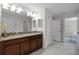 Clean bathroom with double vanity and granite countertop at 1427 Rolling Fairway Dr, Davenport, FL 33896