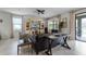 Living room with dark leather sofas and a large entertainment center at 1427 Rolling Fairway Dr, Davenport, FL 33896