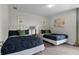 Guest bedroom with two twin beds and decorative wall art at 1427 Rolling Fairway Dr, Davenport, FL 33896