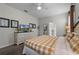 Bedroom with king-size bed, dresser, and ensuite bath at 1427 Rolling Fairway Dr, Davenport, FL 33896