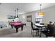 Game room with pool table and bar-height table at 1427 Rolling Fairway Dr, Davenport, FL 33896