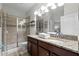Bathroom boasts a double vanity and a walk-in shower at 1427 Rolling Fairway Dr, Davenport, FL 33896