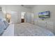 Comfortable bedroom with king-size bed and dresser at 1427 Rolling Fairway Dr, Davenport, FL 33896