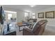 Relaxing living room featuring brown leather reclining sofas at 1427 Rolling Fairway Dr, Davenport, FL 33896
