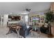 Open concept living room with a large TV and comfortable seating at 1427 Rolling Fairway Dr, Davenport, FL 33896