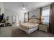 King-size bed, TV, and ensuite bathroom at 1427 Rolling Fairway Dr, Davenport, FL 33896