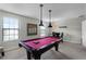 Game room with pool table and seating area at 1427 Rolling Fairway Dr, Davenport, FL 33896