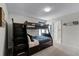Bedroom with a built-in bunk bed and plenty of storage at 1427 Rolling Fairway Dr, Davenport, FL 33896