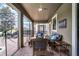 Relaxing screened patio with wicker furniture and adjacent pool at 1427 Rolling Fairway Dr, Davenport, FL 33896