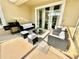 Relaxing patio with wicker furniture, a grill, and a view of the backyard at 9095 Sommerset Hills Dr, Davenport, FL 33896