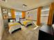 Mickey Mouse themed bedroom with two twin beds and yellow accents at 9095 Sommerset Hills Dr, Davenport, FL 33896