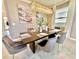 Formal dining room with a large table, chandelier, and modern chairs at 9095 Sommerset Hills Dr, Davenport, FL 33896