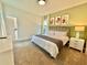 Spacious bedroom with king-size bed, large windows, and neutral decor at 9095 Sommerset Hills Dr, Davenport, FL 33896