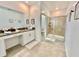 Large bathroom with double vanity, walk-in shower, and toilet at 9095 Sommerset Hills Dr, Davenport, FL 33896
