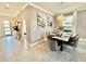 Bright and airy entryway with tile flooring and modern console table at 9095 Sommerset Hills Dr, Davenport, FL 33896