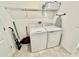 Convenient laundry room with washer, dryer, and overhead shelving at 9095 Sommerset Hills Dr, Davenport, FL 33896