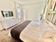 King-size bed, dresser, and access to a private balcony at 9095 Sommerset Hills Dr, Davenport, FL 33896