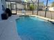 Inviting screened pool with basketball hoop at 1138 Knollwood Dr, Davenport, FL 33837