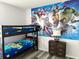 ' bedroom with bunk beds and a Marvel mural at 1138 Knollwood Dr, Davenport, FL 33837