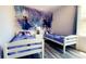 Charming bedroom with twin beds and Frozen wall decor at 1138 Knollwood Dr, Davenport, FL 33837