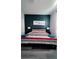 Bedroom with king-size bed and dark-blue accent wall at 1138 Knollwood Dr, Davenport, FL 33837