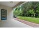 Private backyard with covered patio and lush landscaping at 1515 Cristalli Ct, Orlando, FL 32828