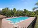 Community swimming pool with lounge chairs and brick patio at 1515 Cristalli Ct, Orlando, FL 32828