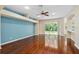 Living room with hardwood floors and blue accent wall at 1515 Cristalli Ct, Orlando, FL 32828