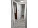 Clean and bright hallway with wood-look flooring at 1250 S Denning Dr # 122, Winter Park, FL 32789