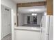 Kitchen with breakfast bar and view of living room at 1250 S Denning Dr # 122, Winter Park, FL 32789