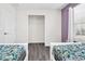 Bedroom with twin beds and a closet at 8930 Sydney Ave, Kissimmee, FL 34747