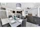 Bright dining room with modern table and chairs, kitchen and living room view at 8930 Sydney Ave, Kissimmee, FL 34747